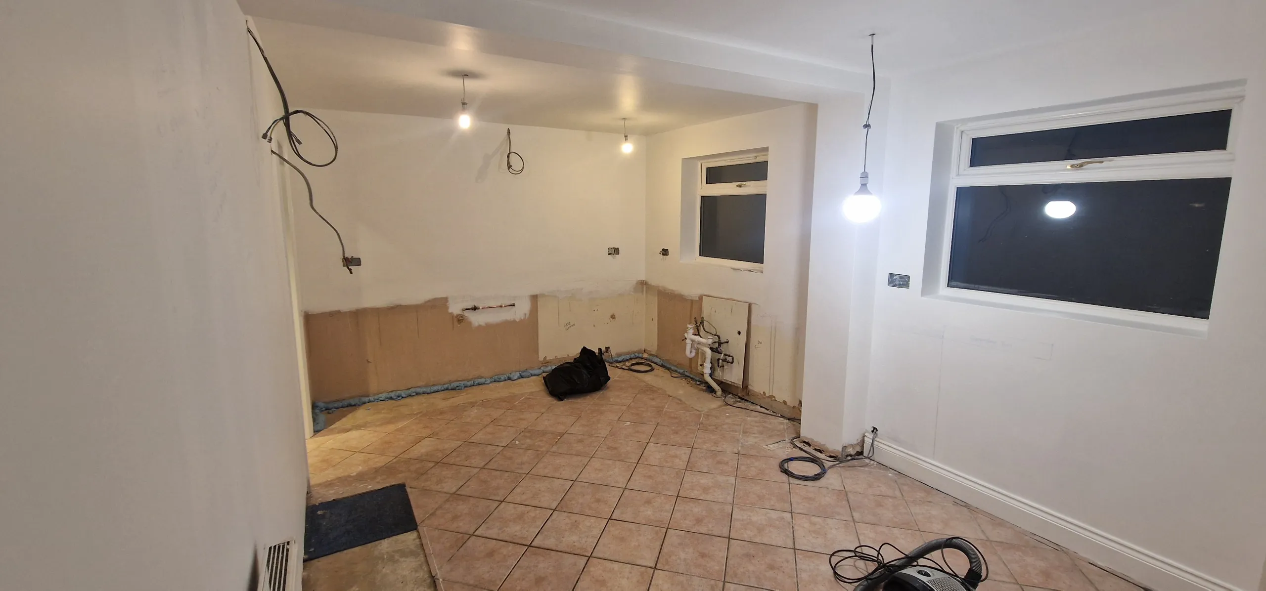 A bright kitchen with freshly painted white walls